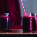 red beverage in mason jars